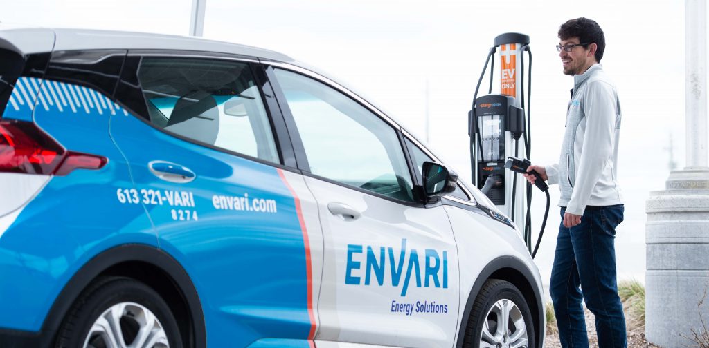 Man charging his electric vehicle.